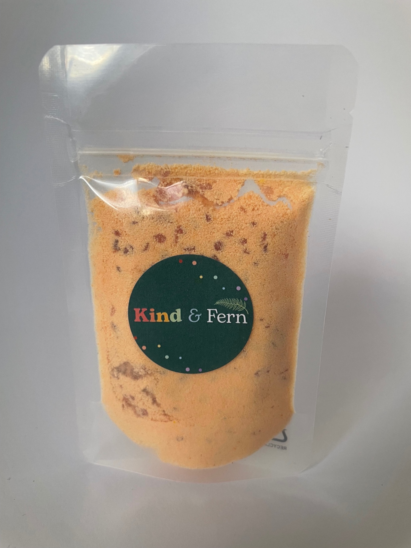 Pouch of Kind & Fern orange rainbow bath dust