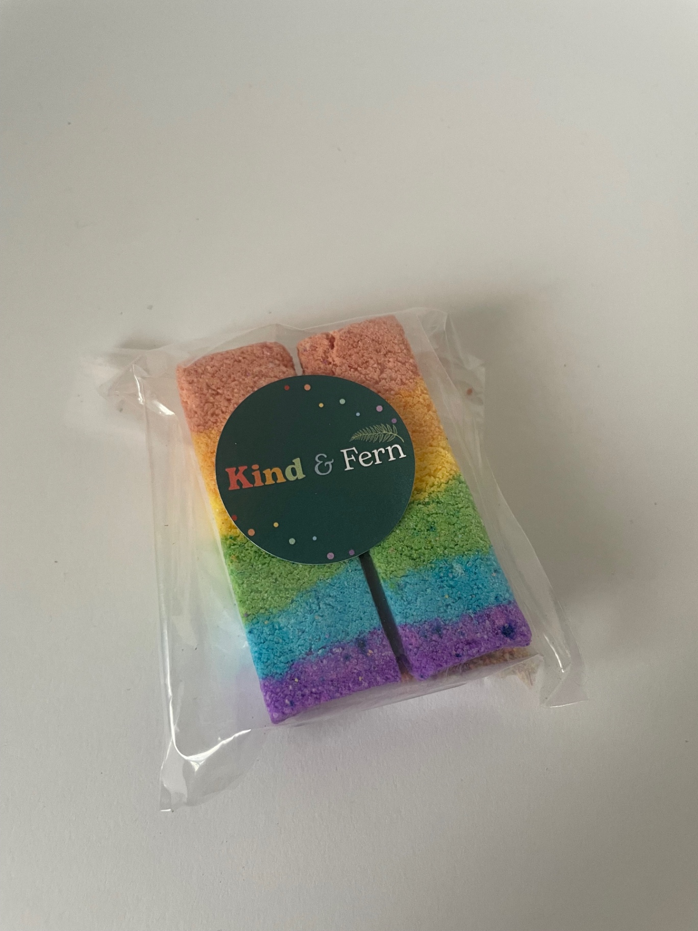 Kind & Fern rainbow layered bath fizz bar in compostable packaging