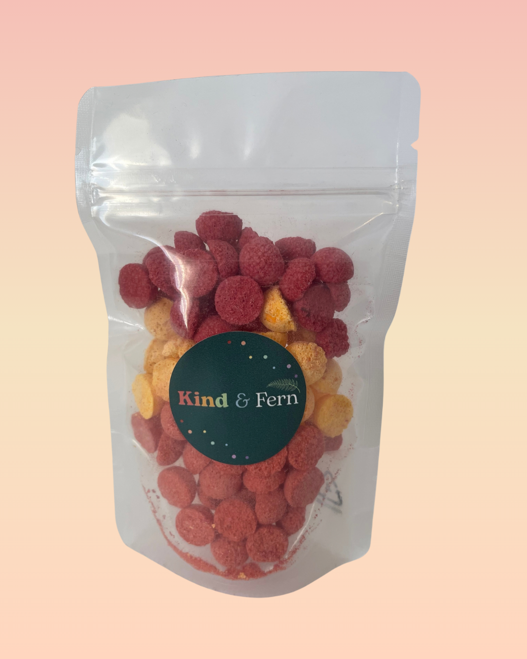 Pouch of Kind & Fern caramel bath teenies in red, orange and yellow